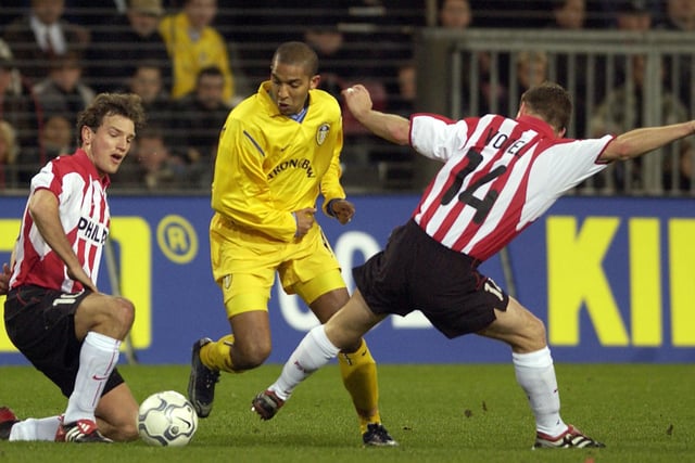 Olivier Dacourt of through the tackle of PSV Eindhoven's Johann Vogel and Arnold Bruggink during the UEFA Cup fourth round first leg clash at the Phillips Stadium in February 2002.