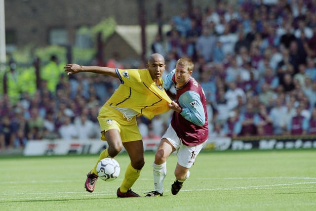 Olivier Dacourt gets the better of West Ham United's John Moncur despite being pulled back during the FA Barclaycard Premiership clash at Upton Park in August 2001.