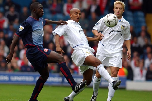 Oliver Dacourt battles for the ball with Arsenal's Kolo Toure during their Premiership clash at Elland Road in September 2002.