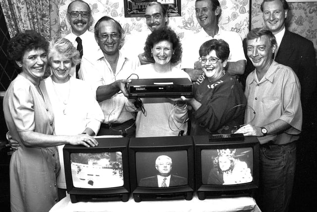 Regulars at The Tippings Arms, Poolstock, raised funds for portable televisions and video recorders for Wigan Infirmary in 1993.