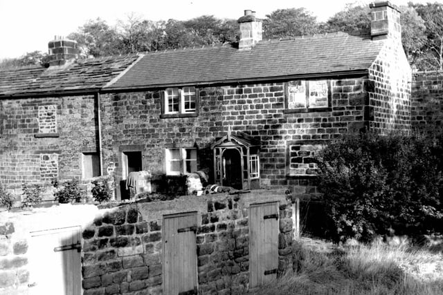 Parkside Road in October 1969 In the foreground are the entrances to three outside toilets with wooden doors. Moving back are stone built houses.