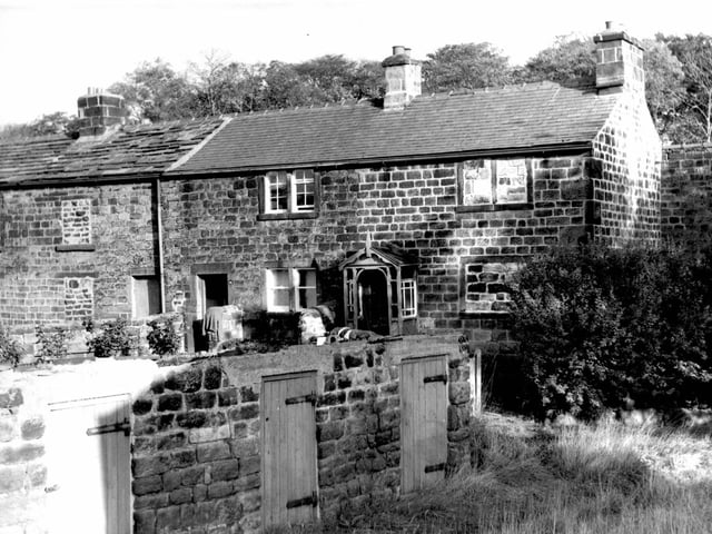 Parkside Road in October 1969 In the foreground are the entrances to three outside toilets with wooden doors. Moving back are stone built houses.