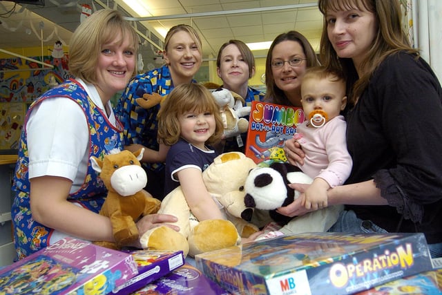 Travelcare staff donate Christmas presents to youngsters on the hospital’s Children’s Ward.