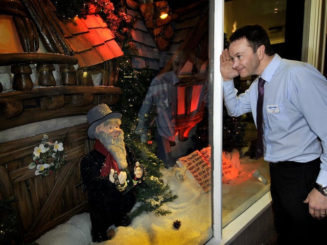 Store manager Chris Golder peers through the window in 2013.