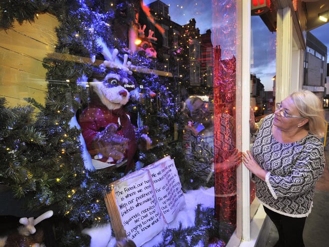Elaine Truman outside the winter forest scene in 2017.