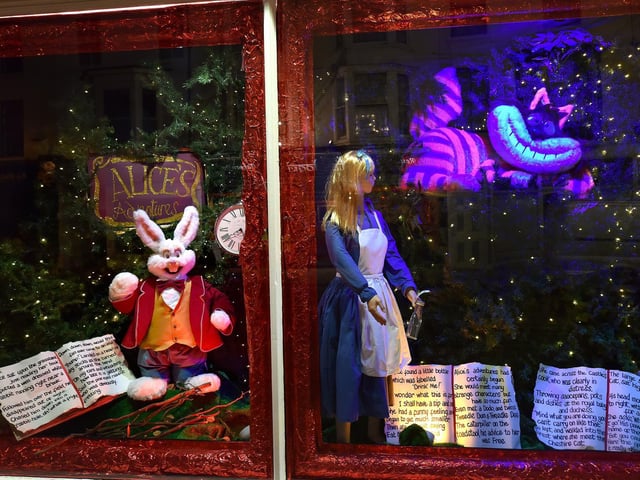The Cheshire Cat grins at passers by in 2018.