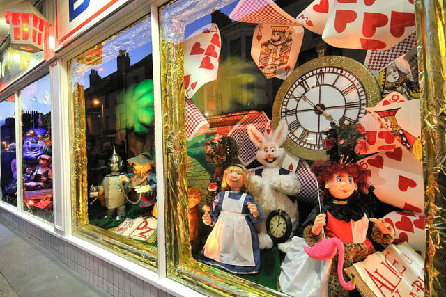 Characters from Alice in Wonderland and The Wizard of Oz featured in the window in 2016.