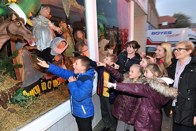 Pupils and staff from Friarage Primary School react to the nativity scene in 2016.