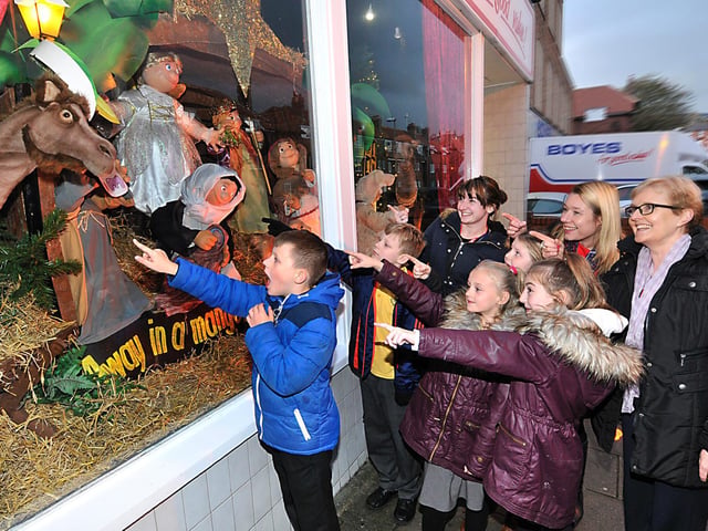 Pupils and staff from Friarage Primary School react to the nativity scene in 2016.