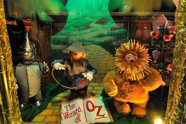 The Cowardly Lion, Tin Man, and Scarecrow feature in the 2016 window.