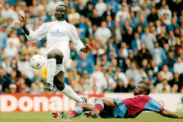 Tony Yeboah avoids the challenge of Aston Villa's Ian Taylor during the Premier League clash against Aston Villa at Elland Road in August 1995. Leeds won 2-0 thanks to goals from David White and Gary Speed.