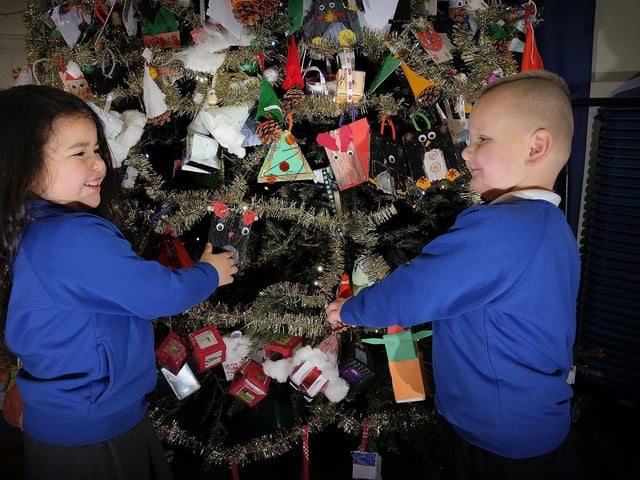 Ella and Jacob with the newly decorated Christmas tree.