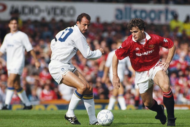 Gary McAllister hunts down Manchester United's Mark Hughes during the Premier League clash at Old Trafford in September 1992.