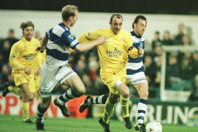 Gary McAllister drives forward against Queens Park Rangers at Loftus Road in March 1996.