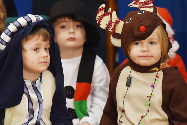 Children dressed up as they take part in the play.