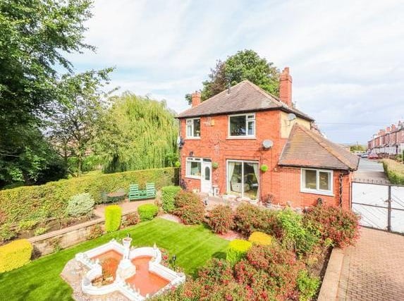 This family home in Wood Lane is up for auction. It is a detached home with three bedrooms and a larger than average back garden. complete with block paved patio area and water feature. It is up for auction with a guide price of £375,000 with Richard Kendall.