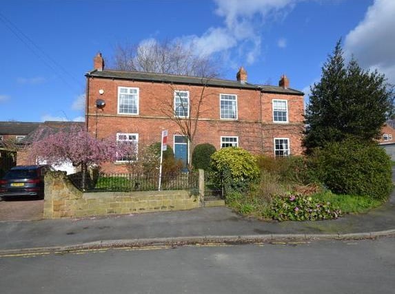 This beautiful period property boasts six bedrooms, five reception rooms and three bathrooms. It has a grand entrance hallway with stone flagged floor and traditional panel wall and retains original features such as the sash windows and cast iron wood burner. The Hollies home is on the market for £600,000 with Manning Stainton.