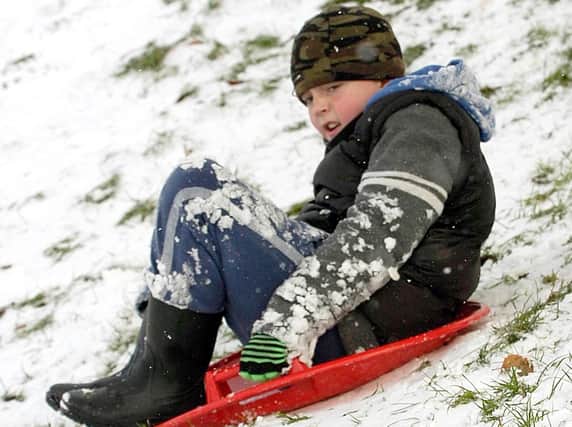 Finlay Hinchliffe-Rae, who was ten, tries out his sledge.