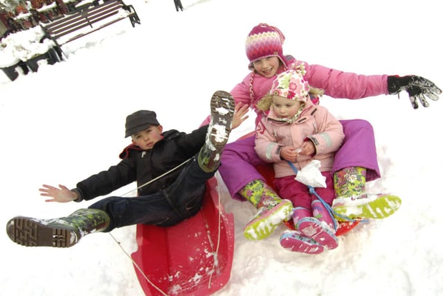 Jack Bonney and Charlotte and Ruby Simms have fun in the snow.