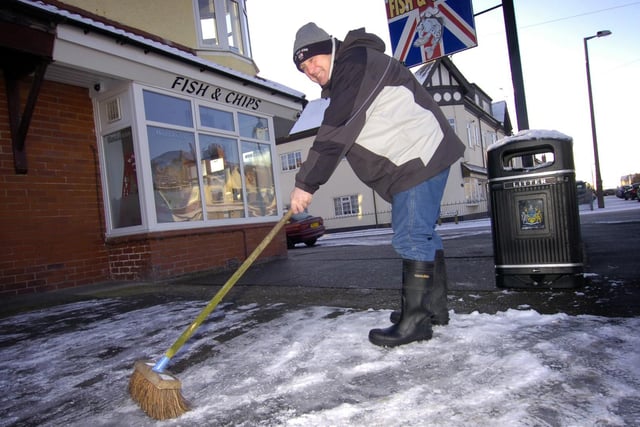 Glenn Bentley of the Beach Rd Fish and Chip shop, Cleveleys, clearing the forecourt in front of his shop