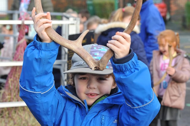 Pupils try antlers for size.