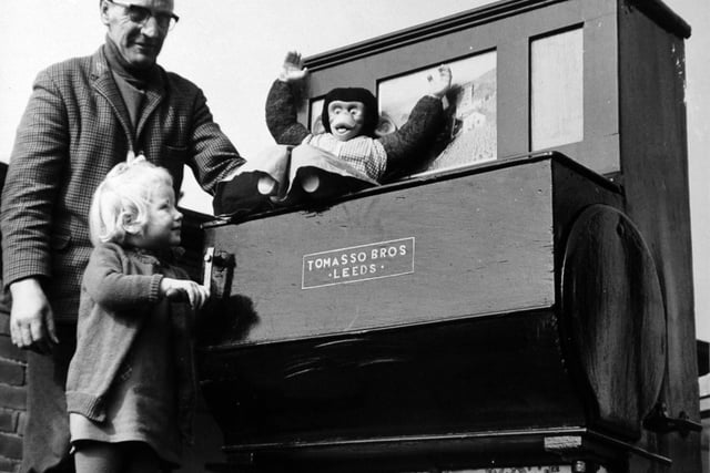 This barrel organ was being loaned to Leeds Playhouse for its production of Robert Pinger's The Old Tune in March 1972.  Pictured is three-year-old Michelle Ibbitson with its owner Dennis Todd.