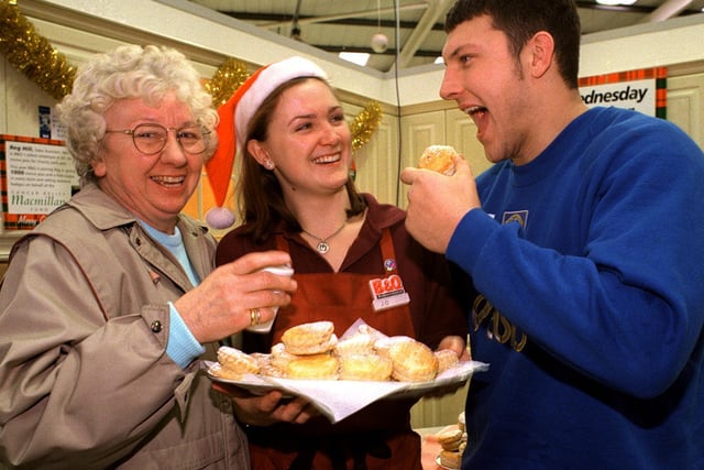 Christmas 1996 and Hilda Walker enjoys a mince pie or two with Leeds RL star Barrie McDermott and Jo Sumnall at the B&Q Mince Pie fundraiser in aid of Cancer Relief Macmillan Fund.