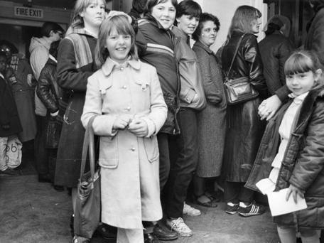 Outside Wykebeck School where people queued for the annual Wykebeck 'Family Allowance Toy Fair' in 1982. It was an opportunity to buy Christmas toys at reasonable prices thanks to donations by local firms and business fairs including 'Toy City'