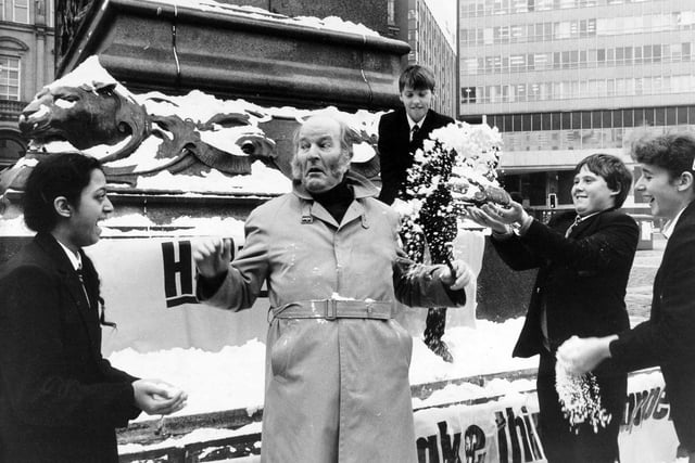 Christmas 1984 and Ronald Magill, alias Emmerdale's Amos Brearley, helps launch Help the Aged's Northern Christmas Appeal. Throwing fake snowballs are, from left, Parminder Binji, Matthew Birch, Stuart Perkins and Erica Withington.
