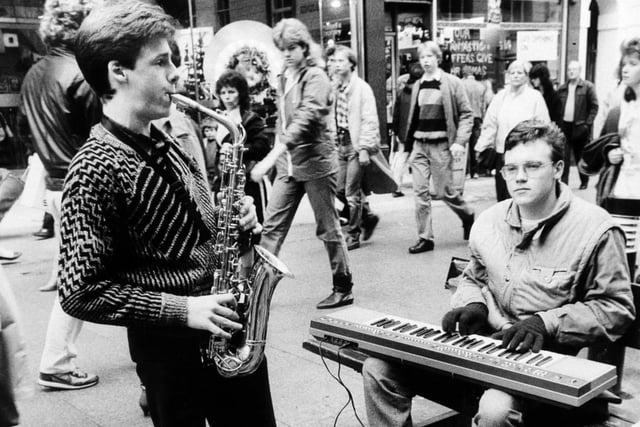 Christmas 1985 and festive generosity was guaranteed to bring city centre buskers out in force to fill the bustling streets with music ranging from rock to the classics. Pictured Andrew Wilson (keyboards) and David Smith (sax) entertain shoppers on Commercial Street.
