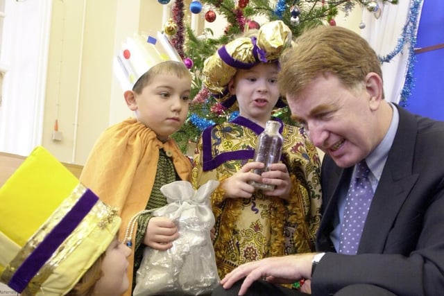 Garforth MP Colin Burgon receives some advice from the three kings after the Christmas production at Garforth Barleyhill Infants in 2001. The children are Polly Benn,Thomas Hindle and Joe Hardy.
