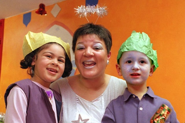 Angie Roper, an outreach worker with Sure Start, was dressed as a fairy for the Christmas party for local children held at Bramley Community Centre in 2001. Enjoying the event are Chanelle Evans and McCauley Swiers.