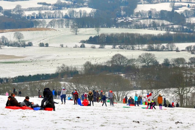 Families have fun on a snow-covered Parbold Hill, January 2013.