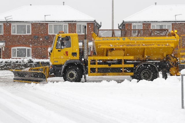 A gritter with a snow plough attached in action on Moor Road, Orrell, January 2010.