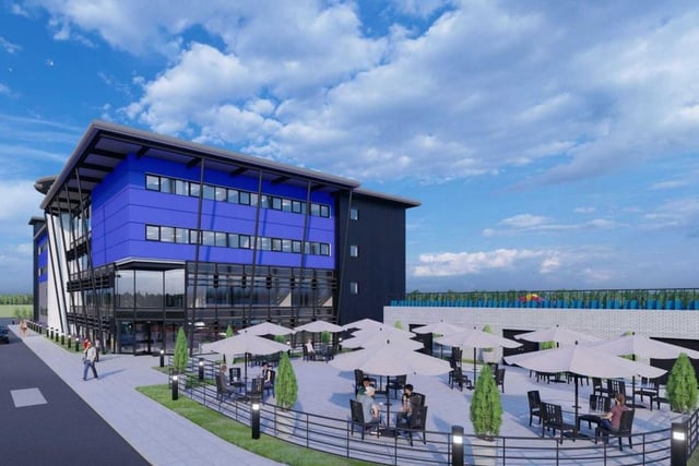 Plans are for the construction of a five-storey hub complete with a cafe, shops, classrooms, meeting areas, and a vehicle repair shop at the Trax Motorsport site on the bans of the River Ribble in Preston. Pic: Trax Motorsport Ltd / De Pol Associates