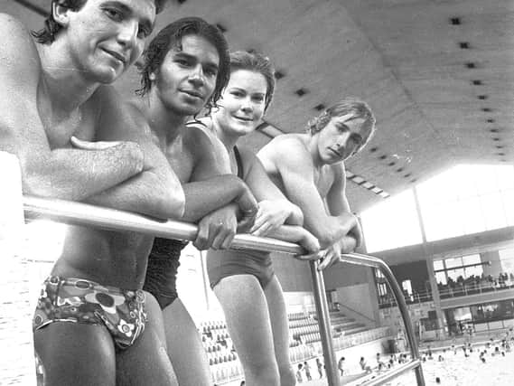 A group of divers line up at the  main pool diving boards at Wigan International Pool in 1974