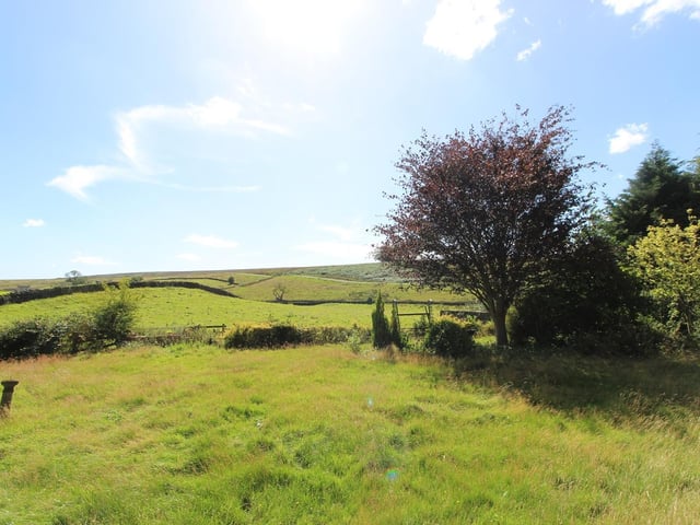 The property is located on the southern edge of the village, with open, uninterrupted views over the moor.