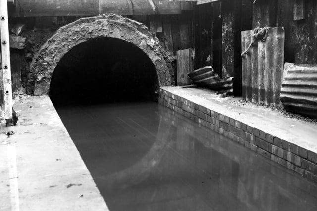 May 1950. Picture shows the low level sewer on South Accommodation Road. Corrugated steel is visible to one side whilst a ladder can be seen on the other.