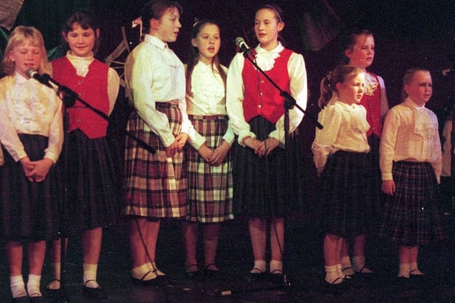 Members of Wigan Thistle Society entertain with a Christmas concert in 1998.