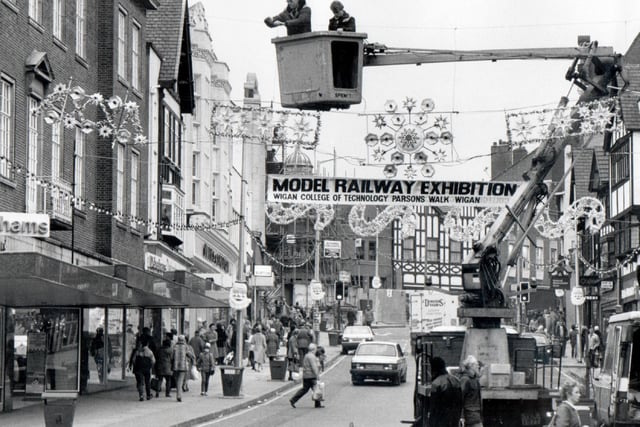 Looking up Standishgate as Christmas lights are being put up in Wigan town centre in 1970's
