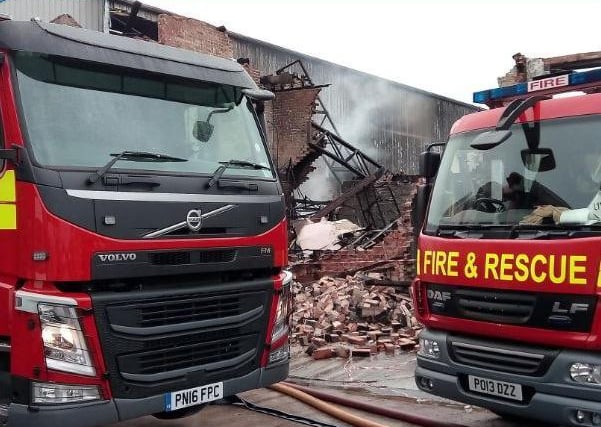 A huge fire took hold at a catering company and spread to the company next door. Nationwide Catering Ltd and the neighbouring Rainbow Candies Ltd were left in ruins by the fire/ The firms pledged to rebuild.