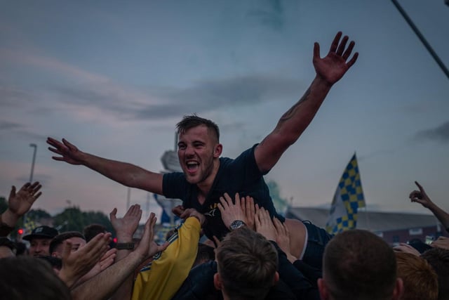 Leeds United Fans celebrate outside Elland Road as they are crowned winners of the Championship and move into the Premier League.