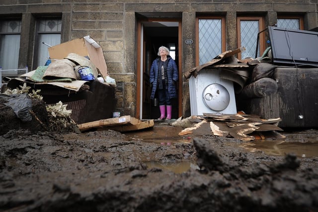Flooding aftermath after Storm Ciara. Rita Gill pictured outside her flooded property on Burnley Road, Mytholmroyd.