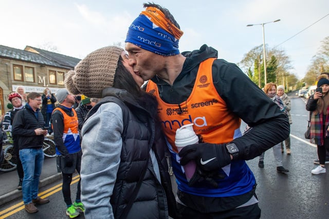 Kevin Sinfield kisses wife Jayne at the finish of his 7 in 7 marathon challenge in aid of Leeds Rhinos player Rob Burrow and in support of MNDA.