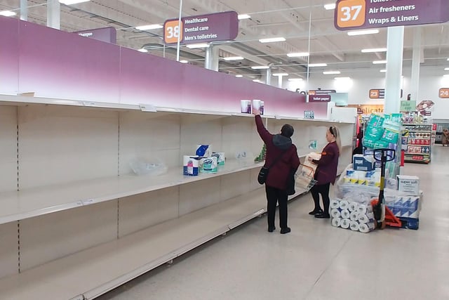 Empty supermarket shelves as people begin to panic buy items such as toilet paper