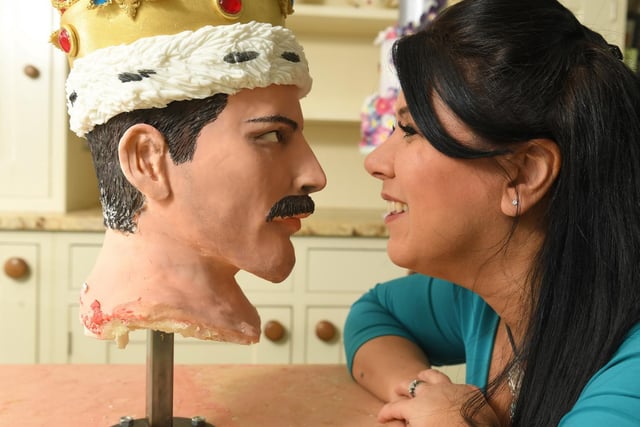 Cake baker Rosie Dummer with Freddie Mercury's head from her life size creation