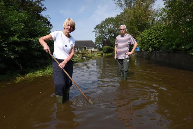 Heavy rain causes flooding in many area around the Fylde Coast. Neighbours Julie Sipson and Alan Brewer on Lower Lane in Freckleton