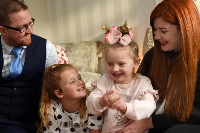 OCTOBER - A really lovely story to follow up and so glad Hallie is doing so well -  Hallie Campbell, seven, from Hindley, her life has changed since she went to Poland last year for pioneering surgery. A rare genetic disorder meant she couldn't walk, talk or sit up, and had painful seizures. Her family managed to raise £70,000 for the surgery and Hallie has made great progress. She has started talking, learning to walk and can sit unaided.  Hallie pictured with mum Lucy Campbell, her partner Barry Gumbley and Hallie's sister Macy, ten.