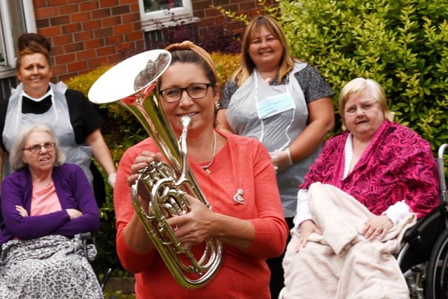 JUNE - Julie Radcliffe plays her baritone horn outside for residents at Appley Court care come, Pemberton - she has been volunteering to entertain residents around the borough during the Covid-19 lockdown.