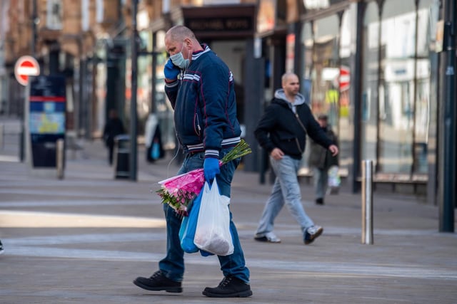 A shopper wears a mask on Briggate. It may seem second nature to us now, but face masks were only made compulsory in shops on July 24.